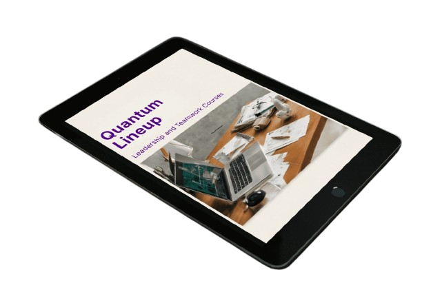 Tablet displaying a presentation slide with 'Quantum Lineup' and images of laptops on a wooden surface.