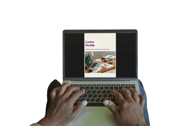 Person using a laptop with a screen displaying 'Luma Guide' on a white background