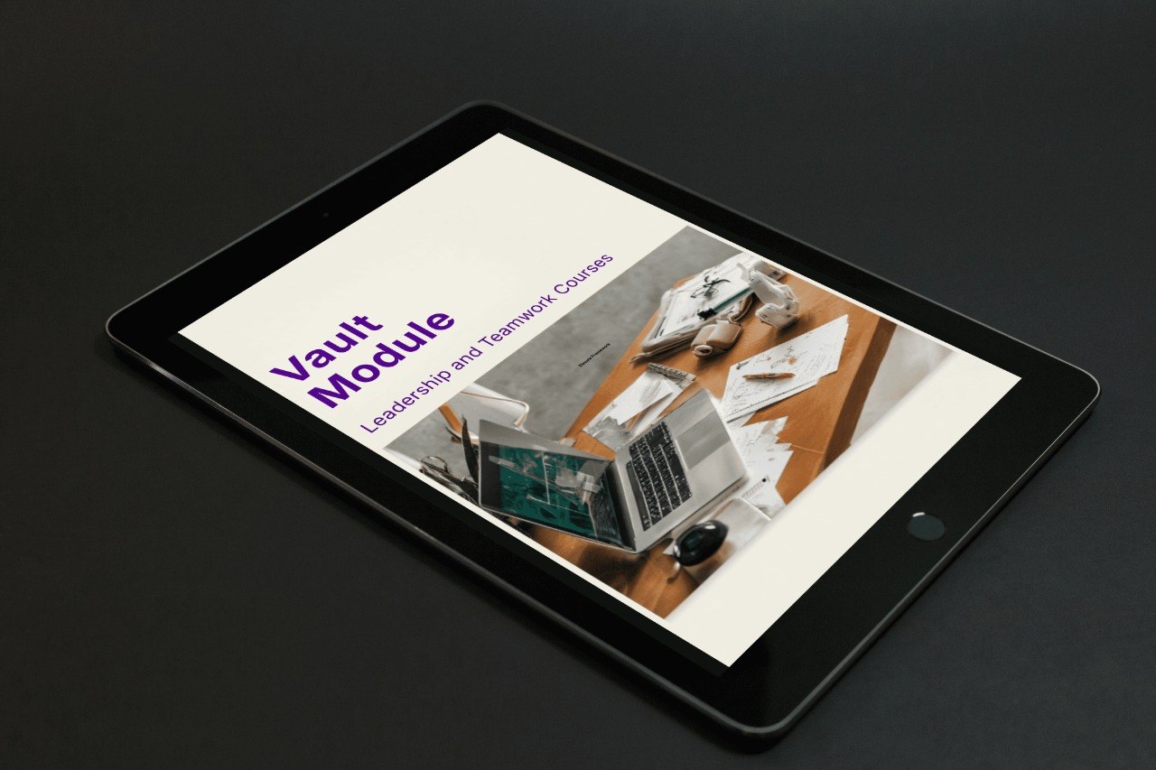 Tablet displaying a presentation slide titled 'Vault Module' on a dark background